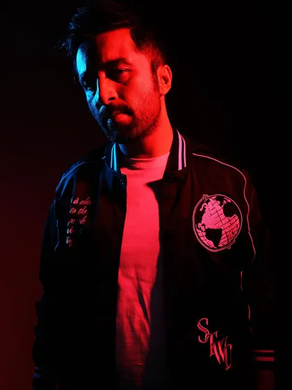 A portrait with dramatic red and blue lighting. The contrast creates a cool, moody vibe.