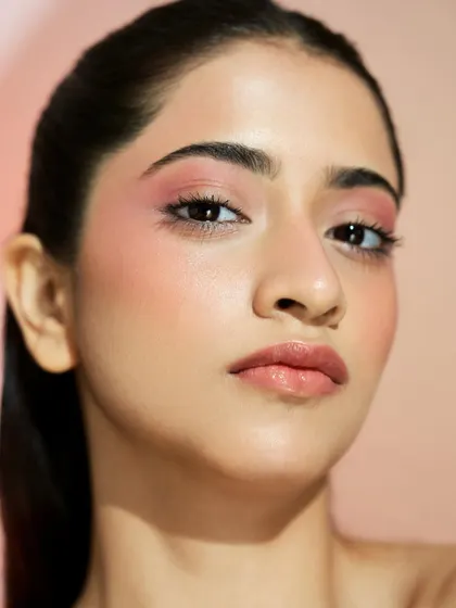 A full-face view of this glowing, natural beauty look. The skin looks healthy and fresh, which is the foundation of any great makeup application.