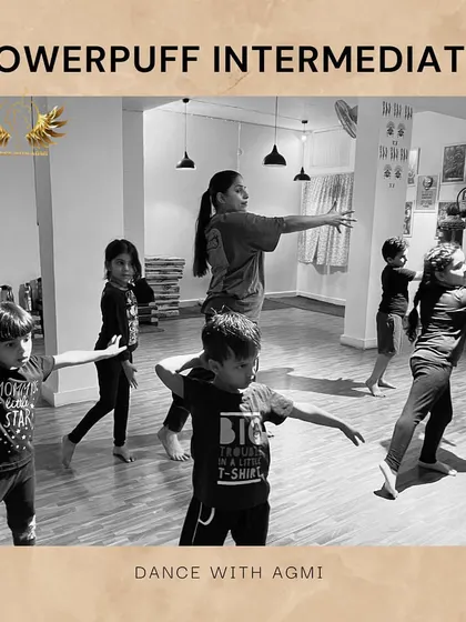 A black and white shot of our Powerpuff Intermediate class. The focus is on clean lines and arm positions, fundamental aspects of their training.