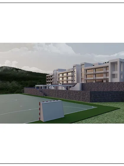 A rendering of a state-of-the-art school in Kangra, Himachal Pradesh. The building is terraced into the hillside, respecting the natural topography while providing modern educational facilities.