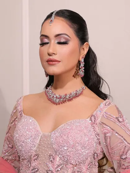 Soft pink hues for the perfect engagement glow. This close-up shows the delicate shimmer on the eyes and the flawless skin.