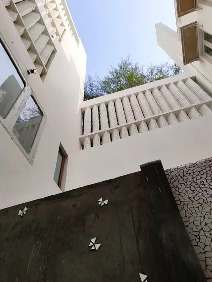 This is a view looking up from within one of our courtyard designs. You can see how the architecture is designed to embrace the open sky, pulling light down into the living spaces. These central courtyards are fundamental to creating homes that breathe and feel connected to nature.