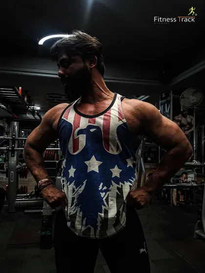 We help you create yourself every day. This pose showcases the results of a disciplined training regimen designed for aesthetic and symmetrical muscle development.