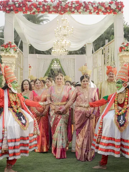 A grand bridal entry for a South Indian wedding, complete with traditional Kathakali dancers. I love incorporating cultural elements in a grand way to make the moments even more special.