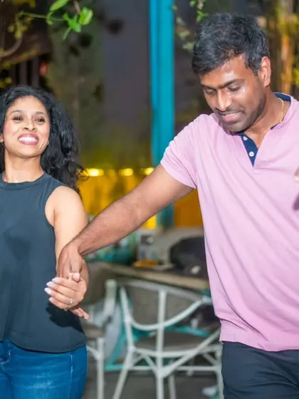 A fun and energetic dance. The smiles and movement capture the essence of La Rumba.