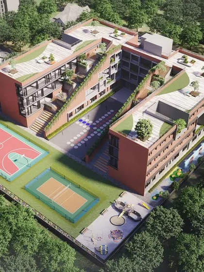 An aerial render of the school in Chhattisgarh, showing the integration of classrooms with outdoor sports courts and green, stepped terraces. The design promotes naturalistic intelligence by making nature an accessible part of the school day.