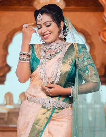 A candid moment, showing the sparkle and detail of our emerald and diamond-look reception jewellery.