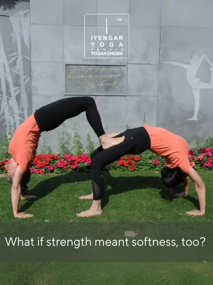What if strength meant softness, too? This partner Urdhva Dhanurasana (Wheel Pose) demonstrates the balance of power and surrender, trust and support, that is central to feminine energy.