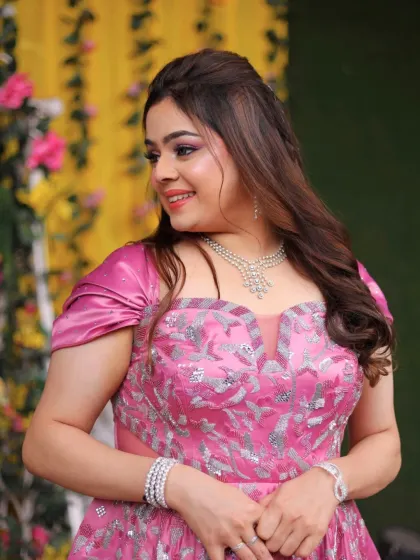 This bride-to-be is a real-life fairytale princess. Her soft glam makeup features dewy skin, fluttery lashes, and a pop of pink.