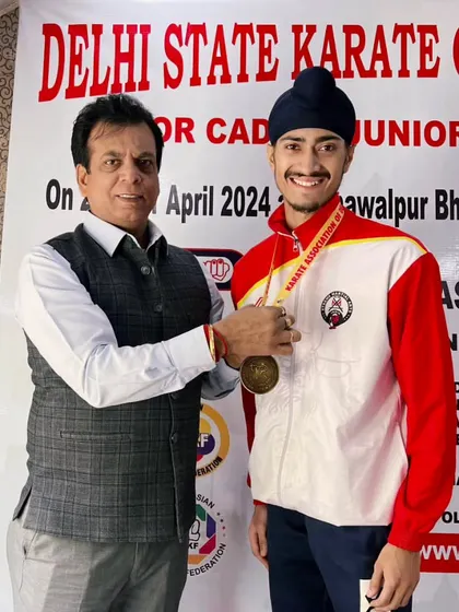 Receiving my 5th consecutive Delhi State Gold from an official. Consistency is the hallmark of a true champion.