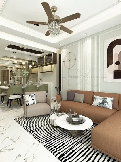 This living room features a comfortable tan sofa, a striking black and white striped rug, and modern art. The fluted wall paneling and clean lines create a contemporary yet inviting atmosphere.