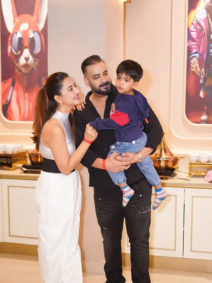 A happy family portrait during a Marvel-themed birthday bash. Our stylish interiors provide a great backdrop for your family photos.