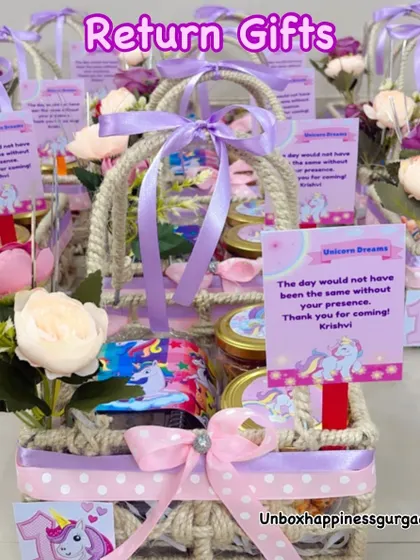 A collection of unicorn-themed return gifts, showcasing the beautiful lavender and pink color palette and personalized tags.