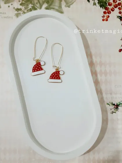 Simple, cute, and festive. These Santa hat hoop earrings are a fun and subtle way to accessorize for the holidays.