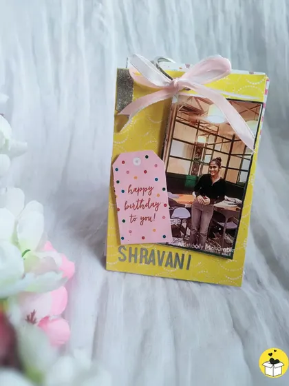Another view of the personalized birthday tag book, tied with a pretty pink ribbon.