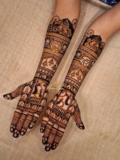 For an NRI bride from Canada, this design incorporates the Sikh Khanda symbol alongside traditional temple and elephant motifs.