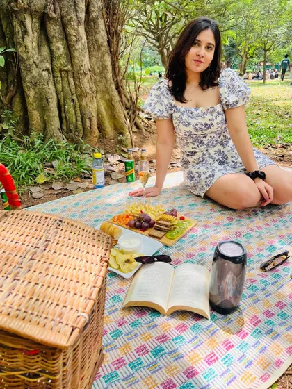 My soft girl era. A beautiful picnic in the park with a charcuterie board, a good book, and some bubbly. It's about creating moments of simple, aesthetic joy for myself.