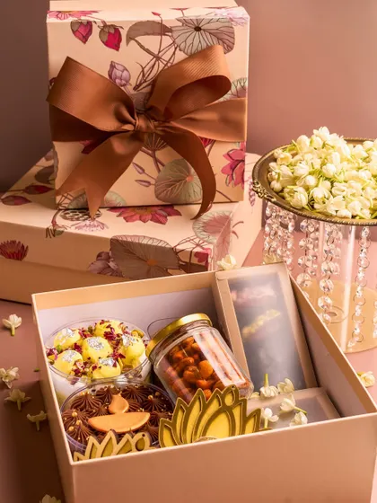 A look inside my "Abundance" Diwali hamper, filled with a variety of my festive desserts, including cake tubs, chocolates, and nuts.