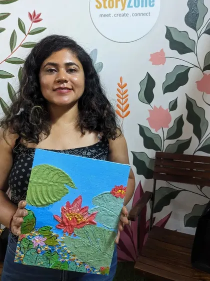 A participant with her intricate lotus pond texture painting. The 3D flowers and leaves make the artwork incredibly lifelike.