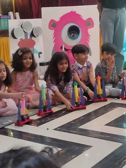 Lined up and ready to go. A group of partygoers prepares for a simultaneous rocket launch, adding a fun, competitive edge to the activity.