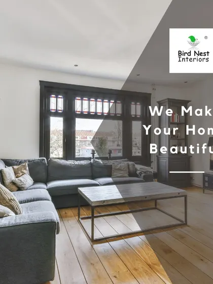 This comfortable living room features a large sectional sofa, perfect for family relaxation. The design utilizes natural light from the large window and a simple layout to create a functional and inviting space.