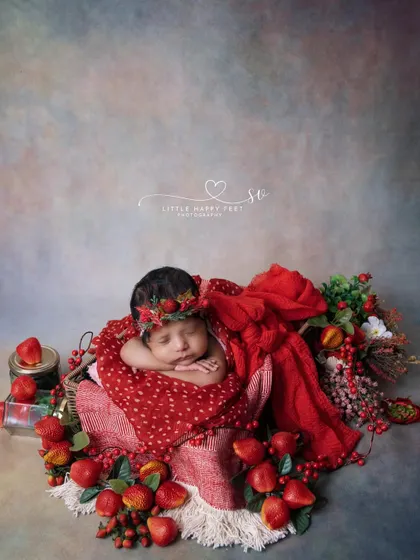 Sweet as a strawberry! This vibrant red theme, complete with a strawberry-themed headband and props, is a fun and fruity choice for a baby girl.