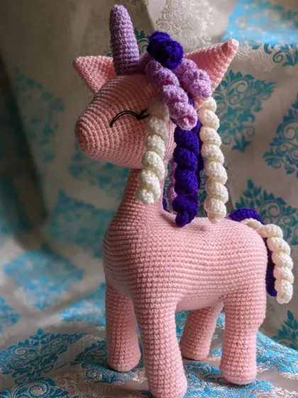 A duplicate image of the pink and purple unicorn.