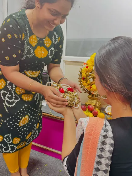 A student receiving her 'gejje' (dancing bells) during the sacred Gejje Pooja ceremony.