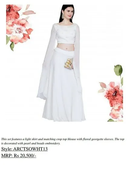 A closer look at the details of our white crop top set, showing the pearl and bead embroidery on the blouse. The flared georgette sleeves add a touch of drama to this elegant outfit.