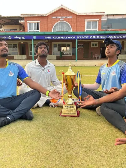 A moment of calm and focus with the TNCA U-23 players and the championship trophy. Mental preparation and recovery are just as crucial as physical training.
