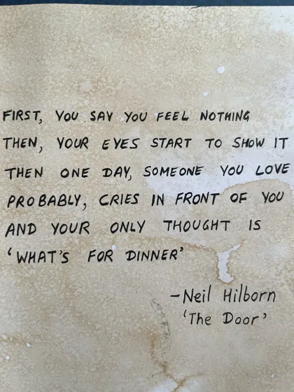 The powerful Neil Hilborn quote that inspired my journal page, handwritten on coffee-stained paper.