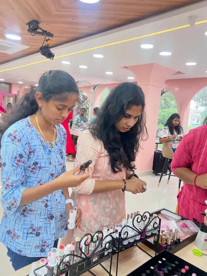 Students exploring different nail polish colors and products during a practice session.