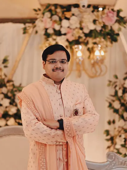 A portrait of the groom looking sharp and ready for the ceremony. We ensure both partners get their moments to shine in the wedding photos.