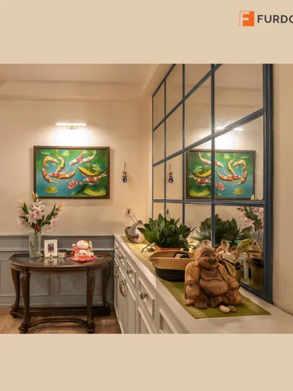 A maximalist Victorian-style foyer with a beautiful painting, antique-style console table, and a large mirror that adds depth and reflects the home's character.