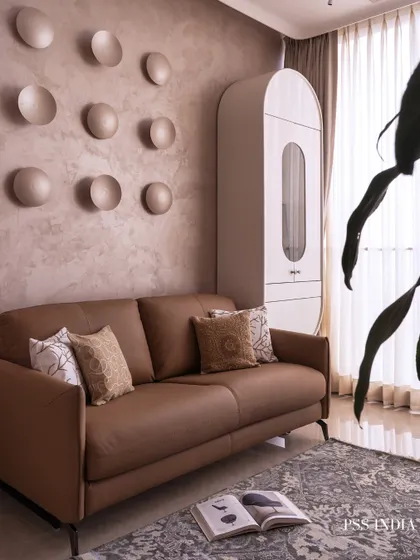 This bedroom is an exercise in soft luxury. I used a palette of grounded neutrals and sculpted textures, like the backlit concave discs on the wall, to create a space that feels both artistic and deeply calming.