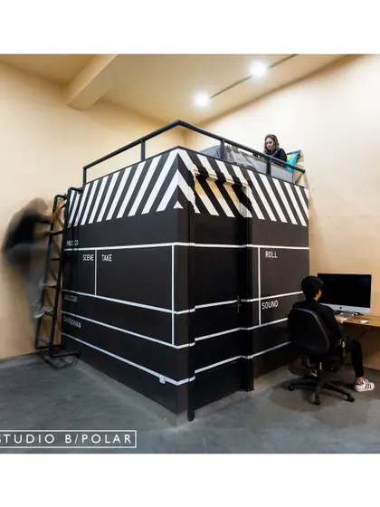 A playful and functional element in the WhiteBalance office is this editing suite designed to look like a giant film clapperboard. It provides a semi-private workspace on two levels, adding a touch of cinematic flair.