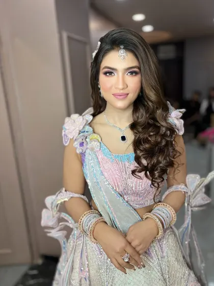 The makeup is soft and pretty, letting the colorful outfit be the main focus.