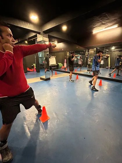 Shadowboxing drills to perfect form. Here, we're working on footwork and punch combinations. It's about building muscle memory so you can react without thinking.