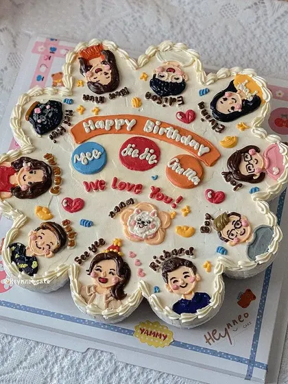 A fun and creative pull-apart cupcake cake. This flower-shaped arrangement is made of 14 individual cupcakes, each decorated with a cute, personalized portrait.