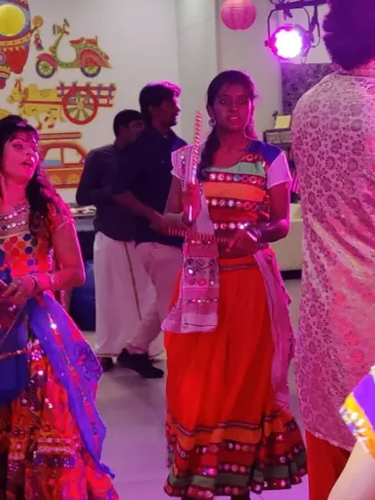 A moment from a Garba night, with participants enjoying the music and dance.