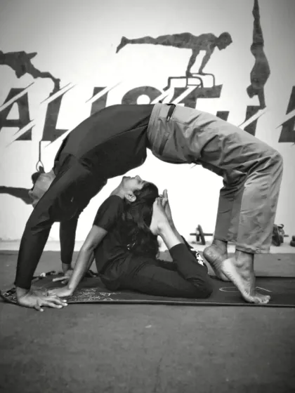 This is what trust, strength, and flexibility look like. We practice partner yoga to help you push past your limits safely, building deeper stretches and an even stronger bond with the CaliGang community. This pose combines a deep backbend (Urdhva Dhanurasana) with a supportive base.