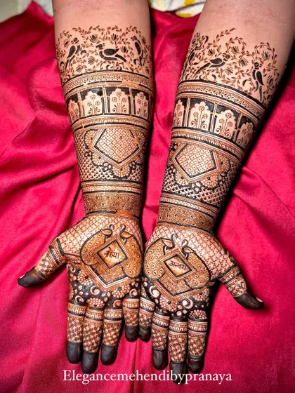 A slightly different angle of the engagement mehendi for Shreya and Ravi, showing the full design with their names included.
