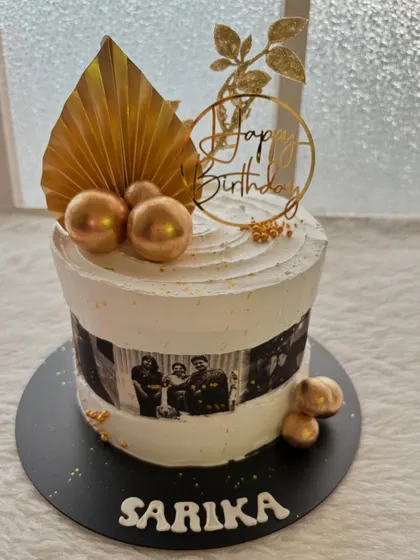 A personalized cake featuring edible photo prints of cherished memories. It's a wonderful way to celebrate a milestone, like this 50th birthday cake for a mom.
