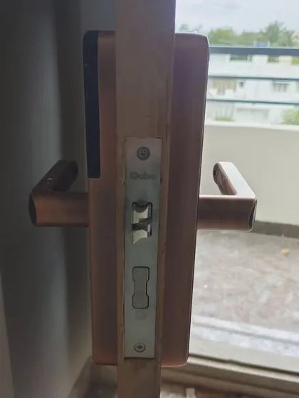 A detailed view of the installed lock mechanism from the side. We ensure every installation is precise and secure, providing a perfect fit for your door frame.
