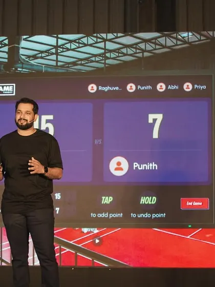 A presenter at our launch event showcases the smart court scoring system. The screen displays the score in real-time, so you never have to worry about keeping track.