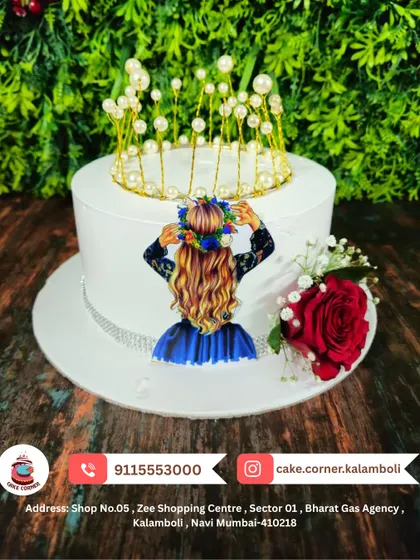 A stylish cake for a queen, featuring a pearl crown and a fresh red rose. The simple elegance of this design makes it perfect for a sophisticated celebration.