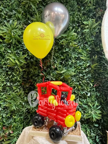 For the sibling who loves adventure, this Rakhi hamper features a fun balloon-sculpted monster truck. It's a creative and personalized gift that goes far beyond the traditional.