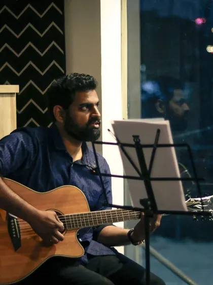 An artist focused on his craft during the 90's Jukebox showcase. Our venue allows for an up-close experience, where you can see the intricate guitar work and passion of each musician.