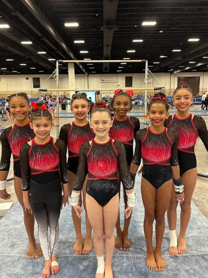 Our Optional Team, featuring gymnasts from Level 6 to 9, looking strong and united at the Metroplex Challenge.