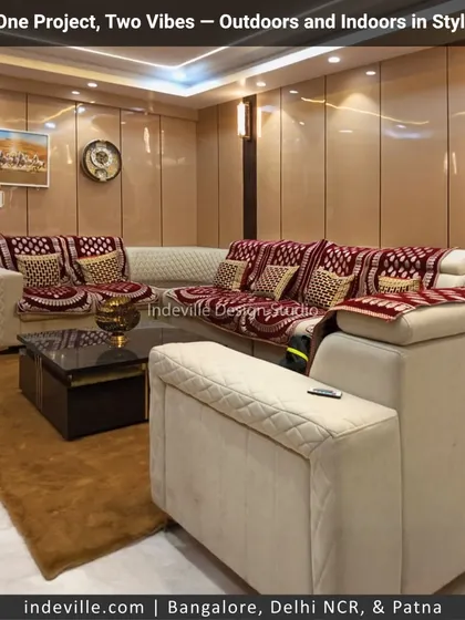 This is a comfortable and cozy family living area from the same project. The design features a large sectional sofa, warm wall paneling, and ambient lighting to create a welcoming space for relaxation.